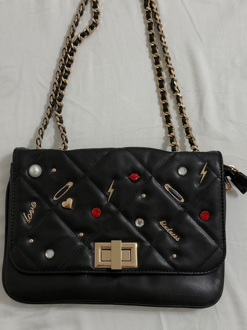 Quilted Aldo Black Shoulder Bag with Gold Chain and Embellishments